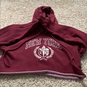 A maroon NY cropped hoodie